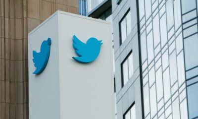 a twitter logo on a column in the city