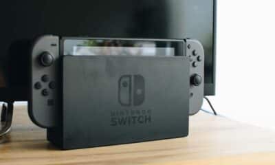 nintendo switch in dock on tv stand