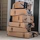 amazon delivery boxes stacked on a porch