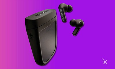 urbanista pheonix solar charging earbuds on purple background
