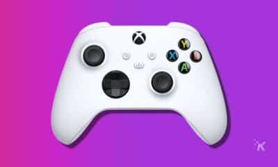 white xbox controller on purple background