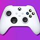 white xbox controller on purple background