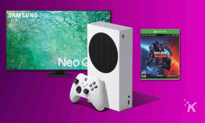 xbox series s with mass effect game next to tv