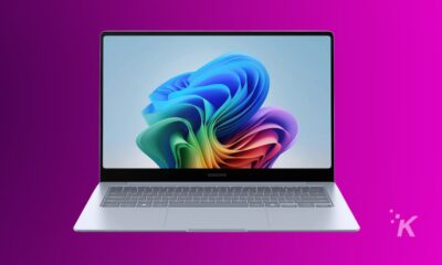 Samsung laptop with colorful abstract wallpaper on screen.