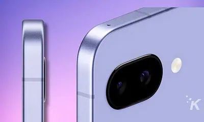 Close-up of smartphone camera module on purple background.