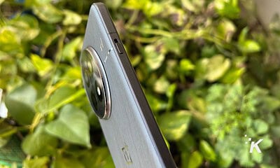 Smartphone side view with focus on camera lens.